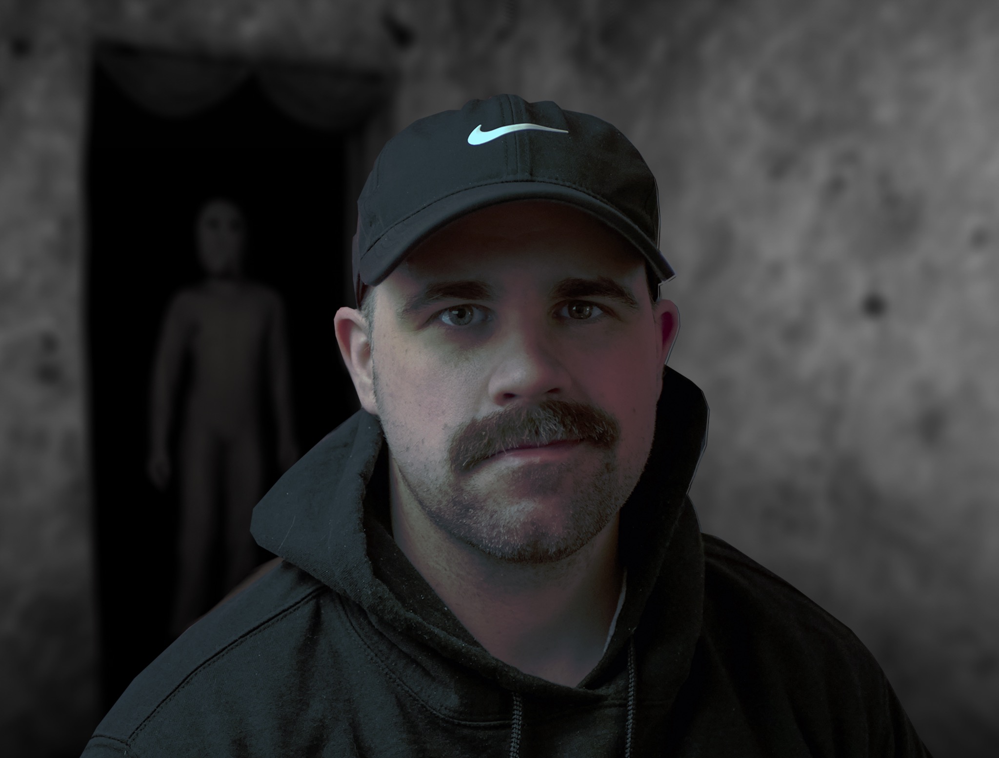 Someone sitting with a creepy cloaked figure watching from a doorway.